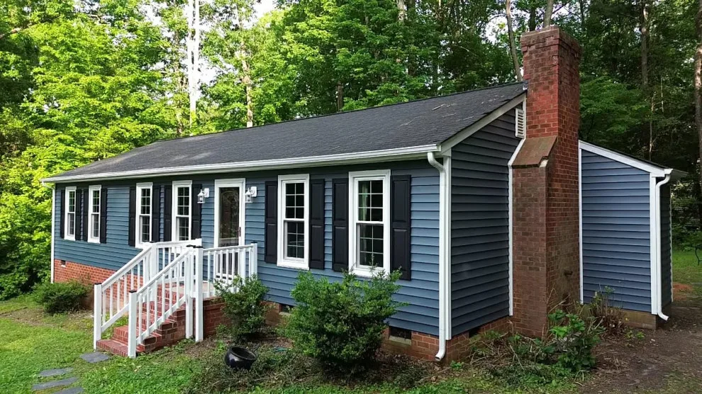 Exterior renovation - siding, window, and gutter replacement by Hammer & Nail Home Improvement, LLC - Photo 8