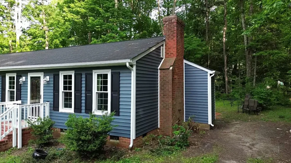 Exterior renovation - siding, window, and gutter replacement by Hammer & Nail Home Improvement, LLC - Photo 4