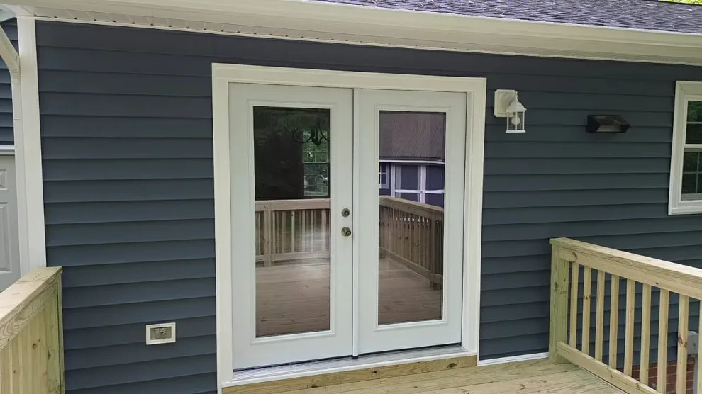 Exterior renovation - siding, window, and gutter replacement by Hammer & Nail Home Improvement, LLC - Photo 7