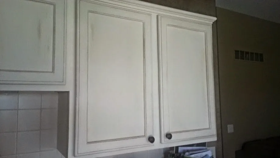 Distressed kitchen cabinets with a painted finish by ValHolla LLC - Photo 2