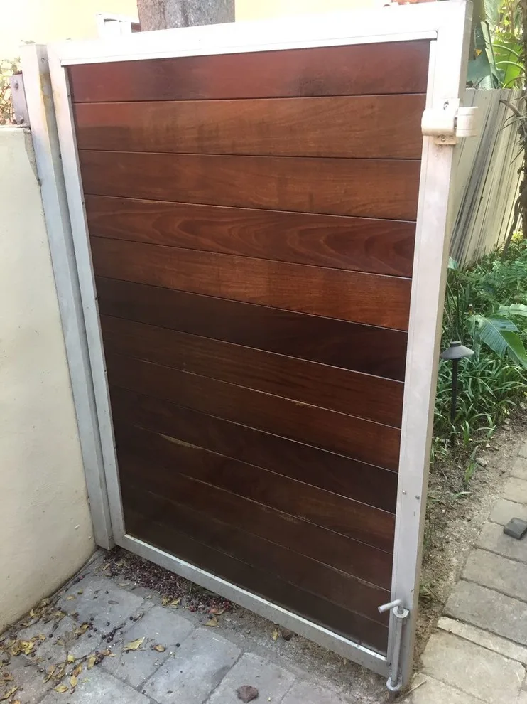 Stained and Refinished Gate by CertaPro Painters Of North Miami - Photo 2