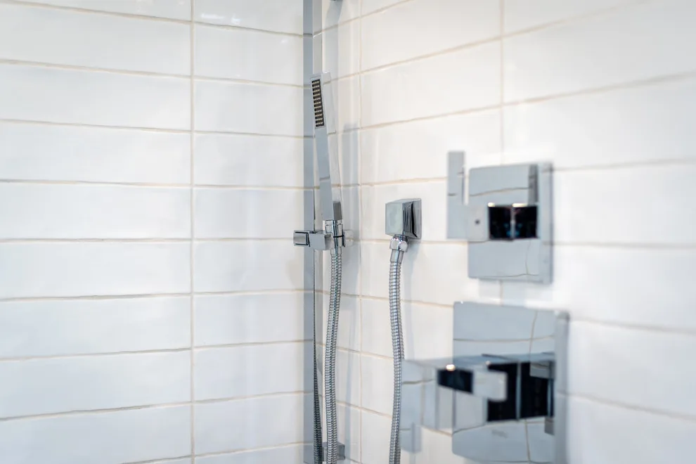 Sleek White Bathrooms by JRP Design & Remodel - Photo 8