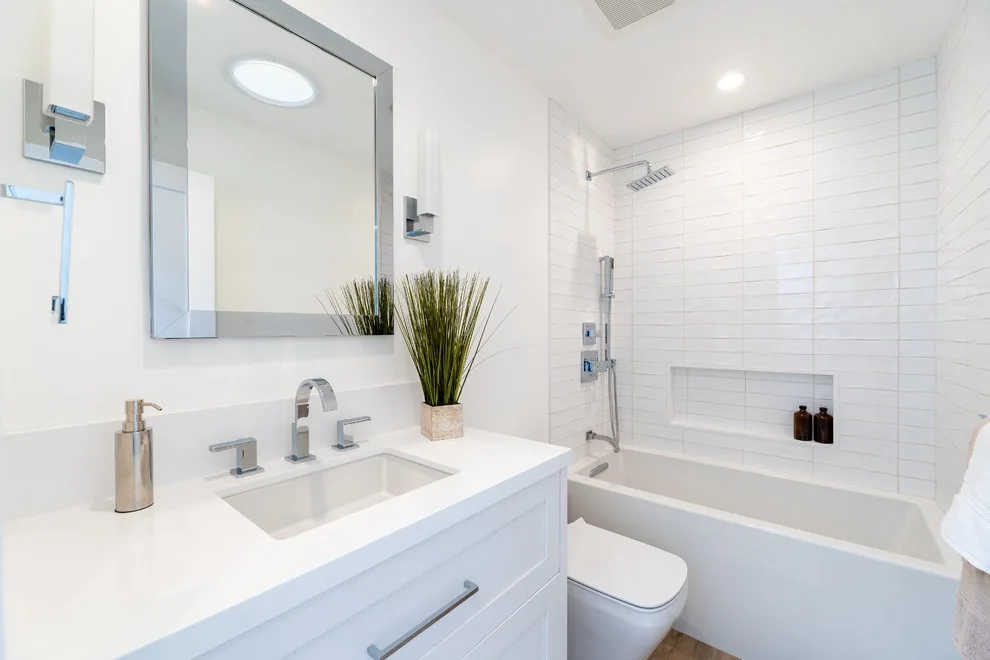 Sleek White Bathrooms by JRP Design & Remodel - Photo 10