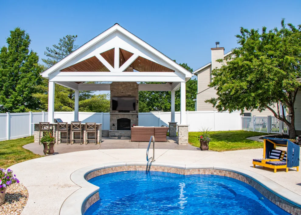 Gabled Pool House Featuring a Fireplace and Grilling Space by Heartlands Building Company - Photo 3