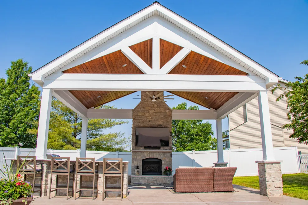 Gabled Pool House Featuring a Fireplace and Grilling Space by Heartlands Building Company - Photo 11