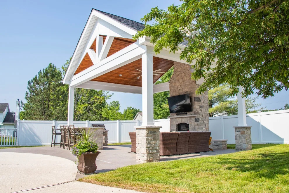 Gabled Pool House Featuring a Fireplace and Grilling Space by Heartlands Building Company - Photo 14