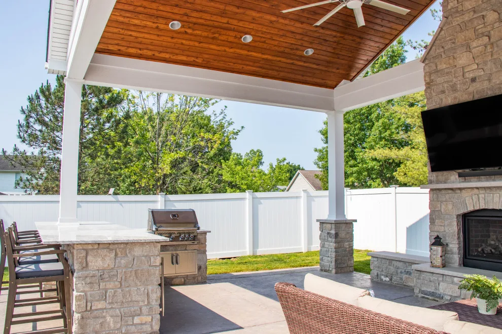 Gabled Pool House Featuring a Fireplace and Grilling Space by Heartlands Building Company - Photo 19