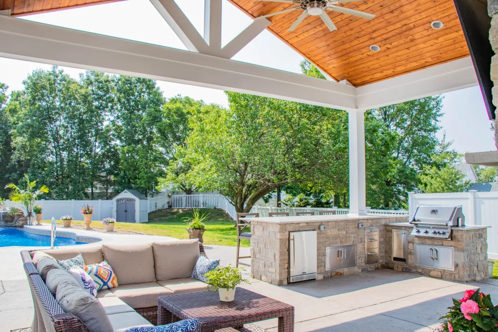 Gabled Pool House Featuring a Fireplace and Grilling Space by Heartlands Building Company - Photo 10
