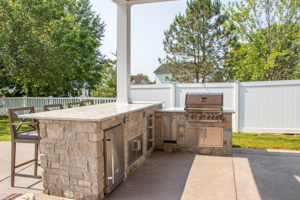 Gabled Pool House Featuring a Fireplace and Grilling Space by Heartlands Building Company - Photo 5