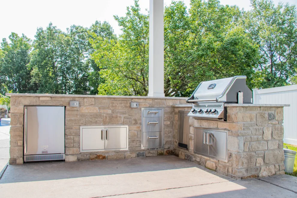 Gabled Pool House Featuring a Fireplace and Grilling Space by Heartlands Building Company - Photo 2