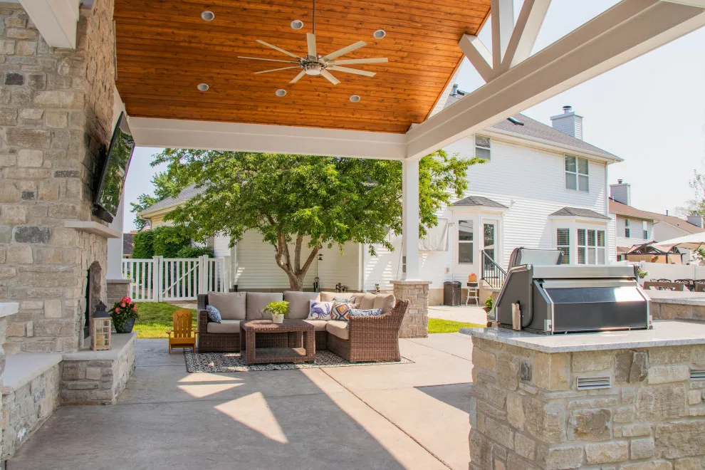Gabled Pool House Featuring a Fireplace and Grilling Space by Heartlands Building Company - Photo 9