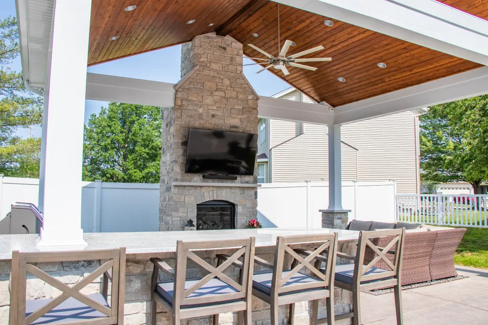 Gabled Pool House Featuring a Fireplace and Grilling Space by Heartlands Building Company - Photo 17