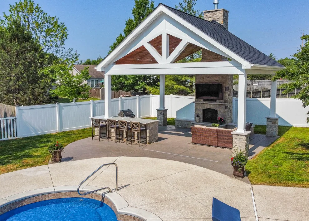Gabled Pool House Featuring a Fireplace and Grilling Space by Heartlands Building Company - Photo 18