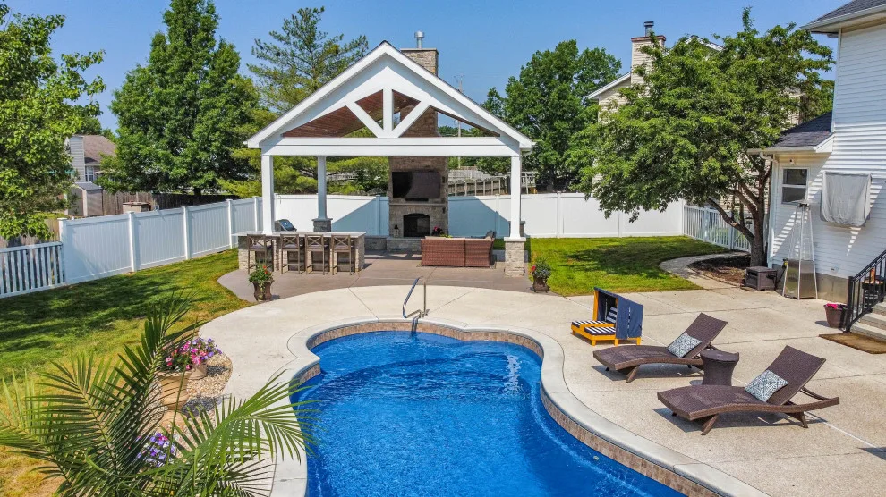 Gabled Pool House Featuring a Fireplace and Grilling Space by Heartlands Building Company - Photo 4