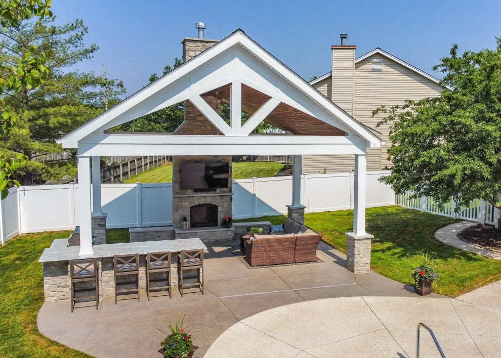 Gabled Pool House Featuring a Fireplace and Grilling Space by Heartlands Building Company - Photo 13