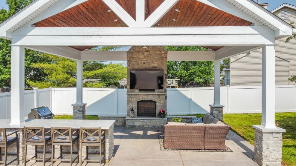 Gabled Pool House Featuring a Fireplace and Grilling Space by Heartlands Building Company - Photo 15