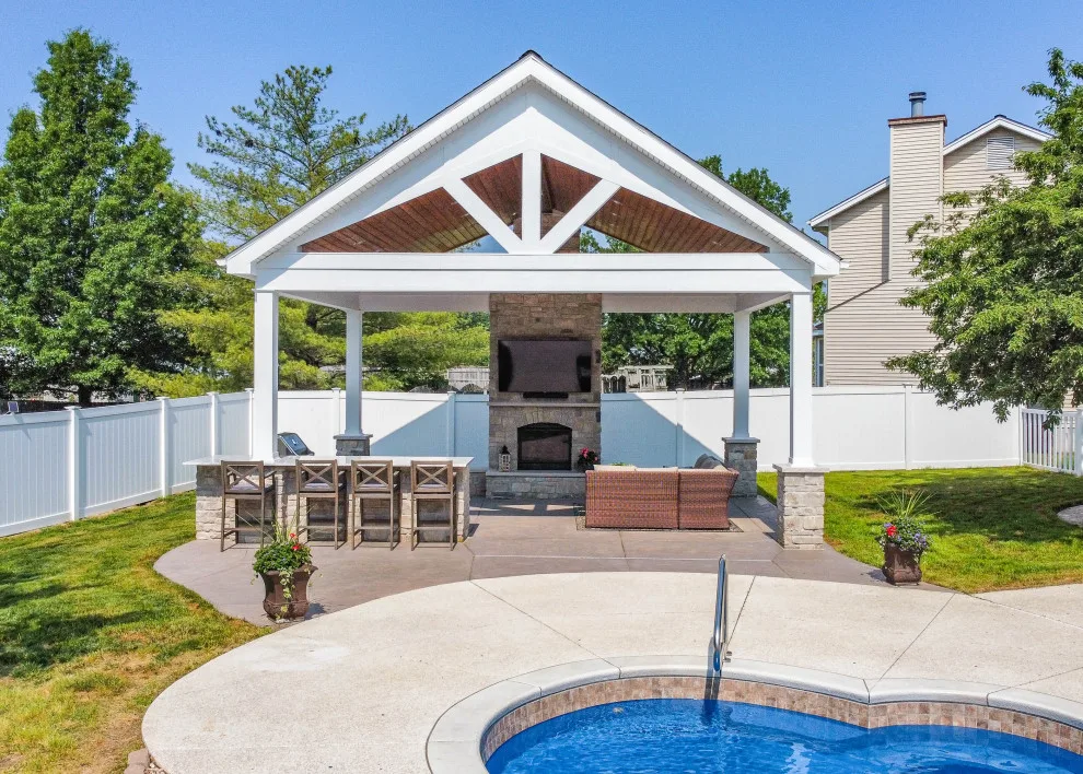 Gabled Pool House Featuring a Fireplace and Grilling Space by Heartlands Building Company - Photo 6