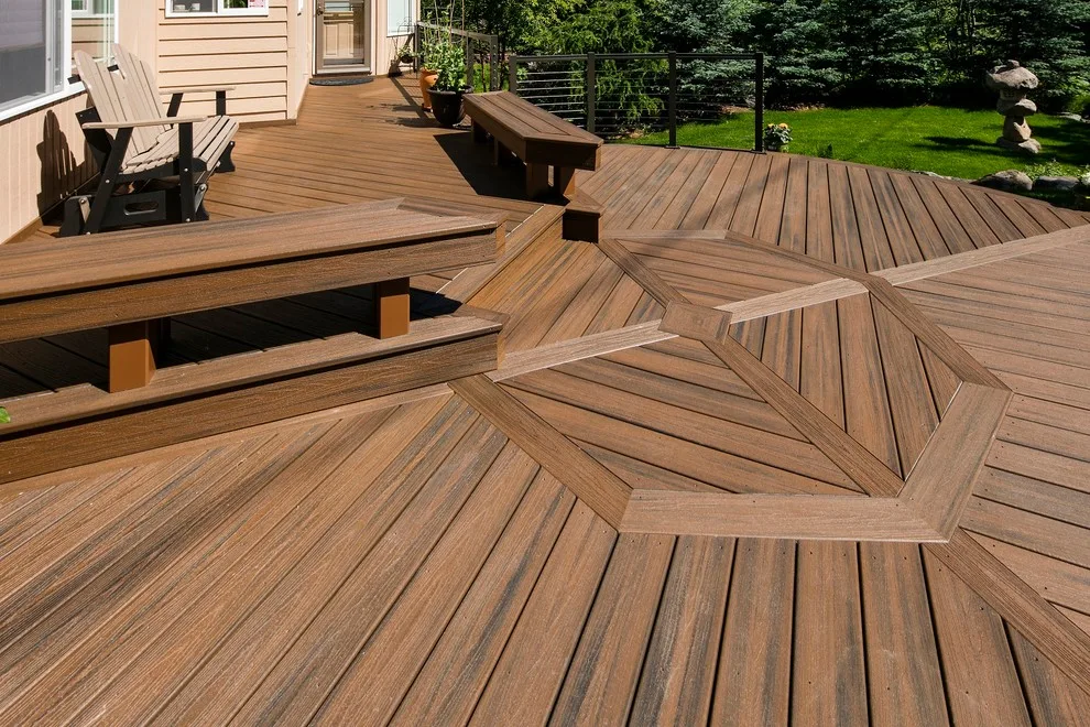 Circular Trex deck with inlay, integrated benches, and aluminum-framed cable railing by Treeline Construction - Photo 4