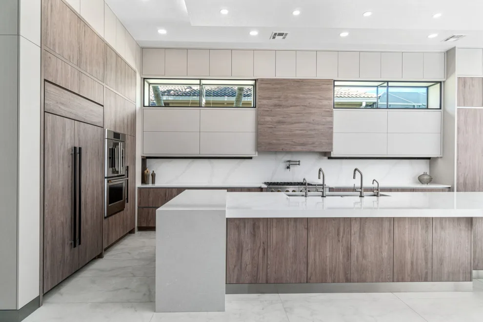 Spacious Modern Two-Tone Kitchen in West Bay by DaVinci Kitchens, Bath, & Cabinetry - Photo 25