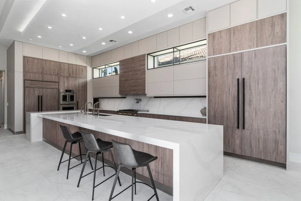Spacious Modern Two-Tone Kitchen in West Bay by DaVinci Kitchens, Bath, & Cabinetry - Photo 22