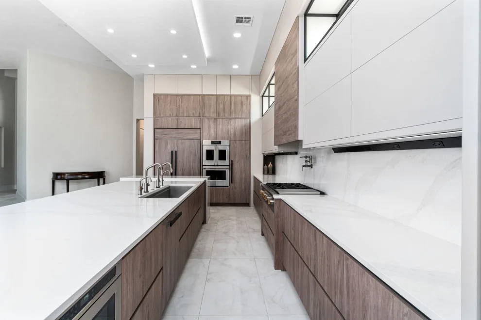 Spacious Modern Two-Tone Kitchen in West Bay by DaVinci Kitchens, Bath, & Cabinetry - Photo 7