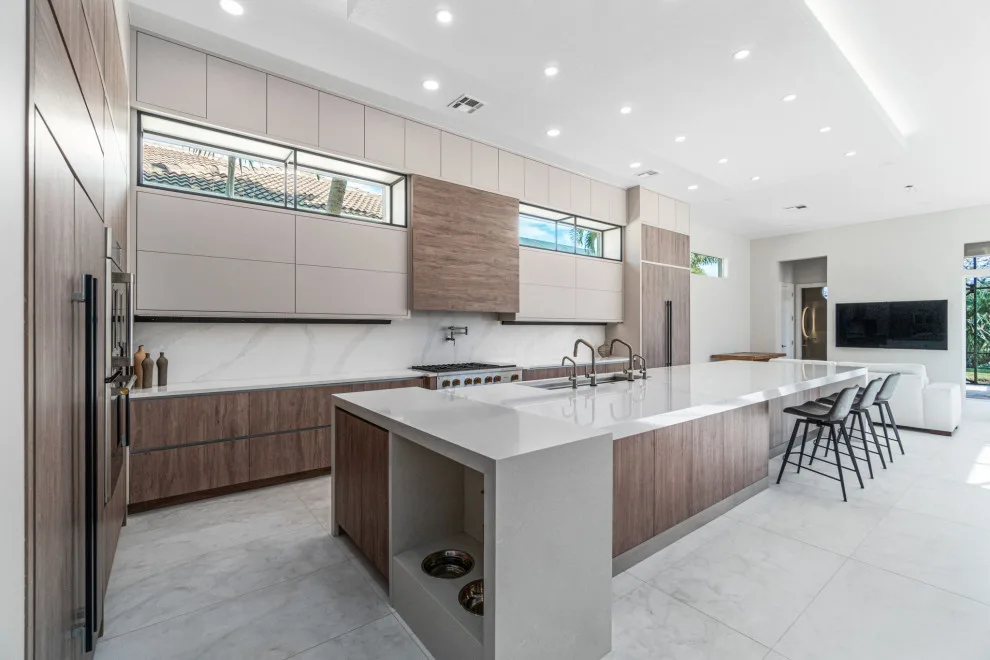 Spacious Modern Two-Tone Kitchen in West Bay by DaVinci Kitchens, Bath, & Cabinetry - Photo 23