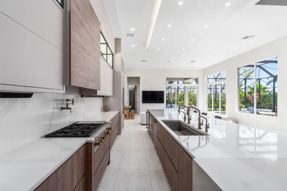 Spacious Modern Two-Tone Kitchen in West Bay by DaVinci Kitchens, Bath, & Cabinetry - Photo 17