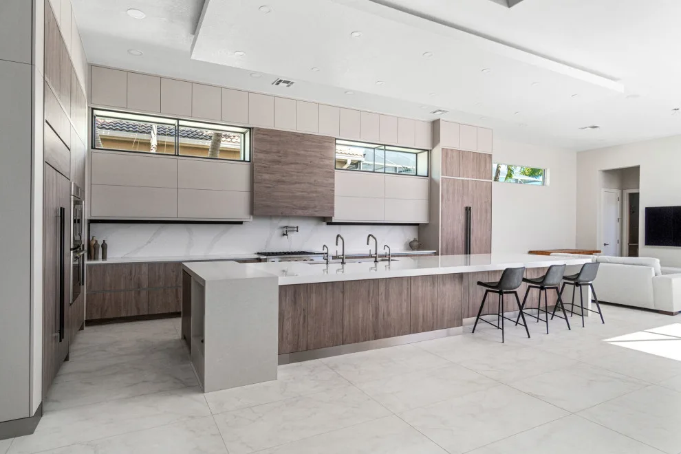 Spacious Modern Two-Tone Kitchen in West Bay by DaVinci Kitchens, Bath, & Cabinetry - Photo 11