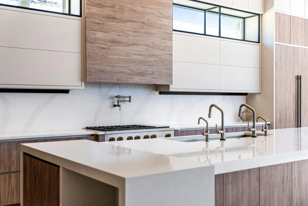 Spacious Modern Two-Tone Kitchen in West Bay by DaVinci Kitchens, Bath, & Cabinetry - Photo 26