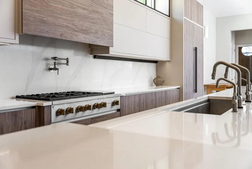 Spacious Modern Two-Tone Kitchen in West Bay by DaVinci Kitchens, Bath, & Cabinetry - Photo 32