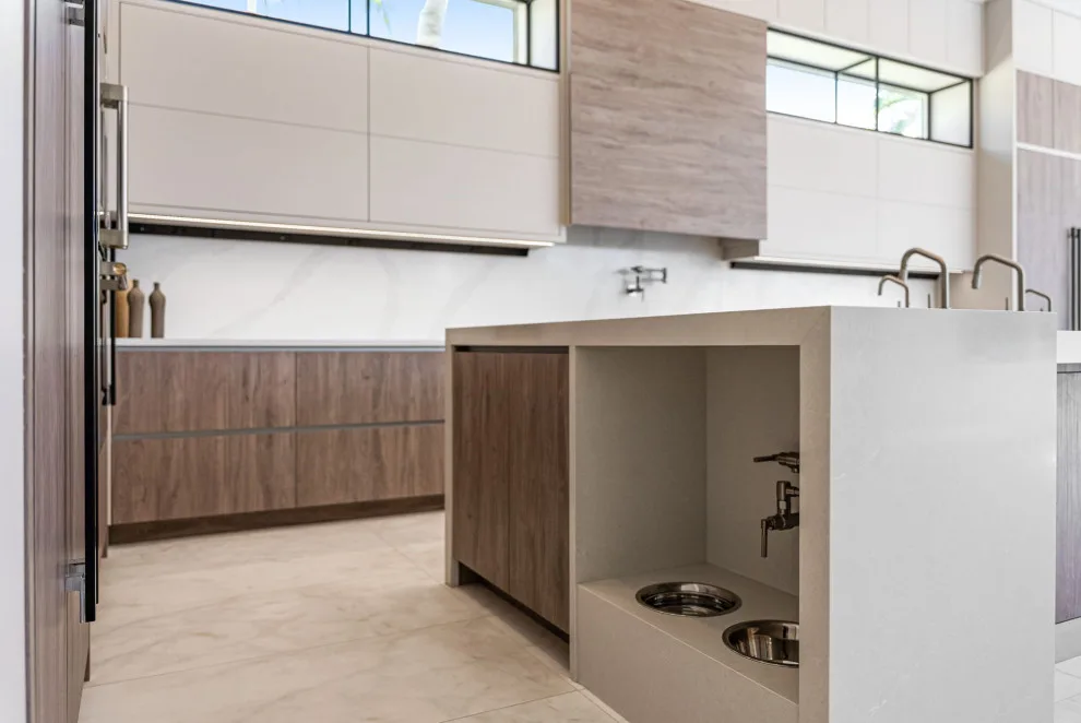 Spacious Modern Two-Tone Kitchen in West Bay by DaVinci Kitchens, Bath, & Cabinetry - Photo 29