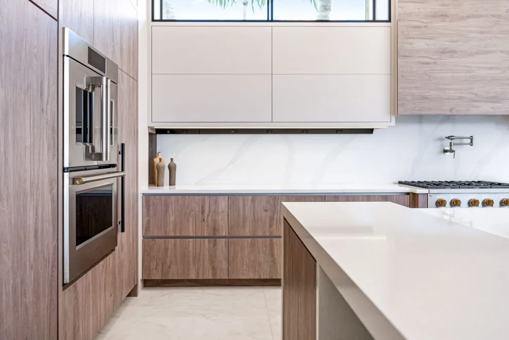 Spacious Modern Two-Tone Kitchen in West Bay by DaVinci Kitchens, Bath, & Cabinetry - Photo 27