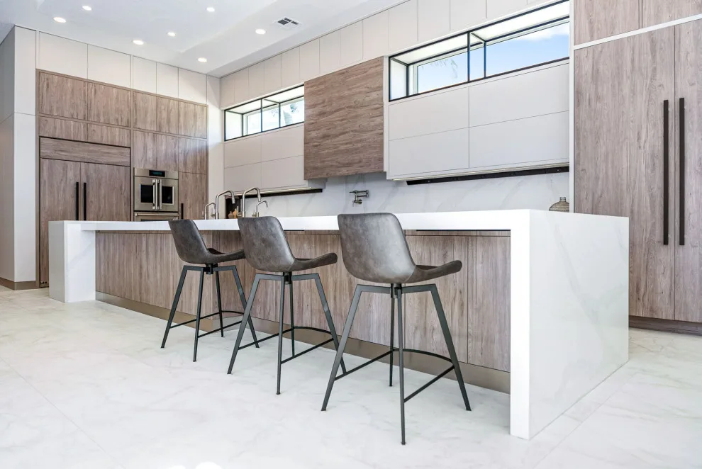 Spacious Modern Two-Tone Kitchen in West Bay by DaVinci Kitchens, Bath, & Cabinetry - Photo 21