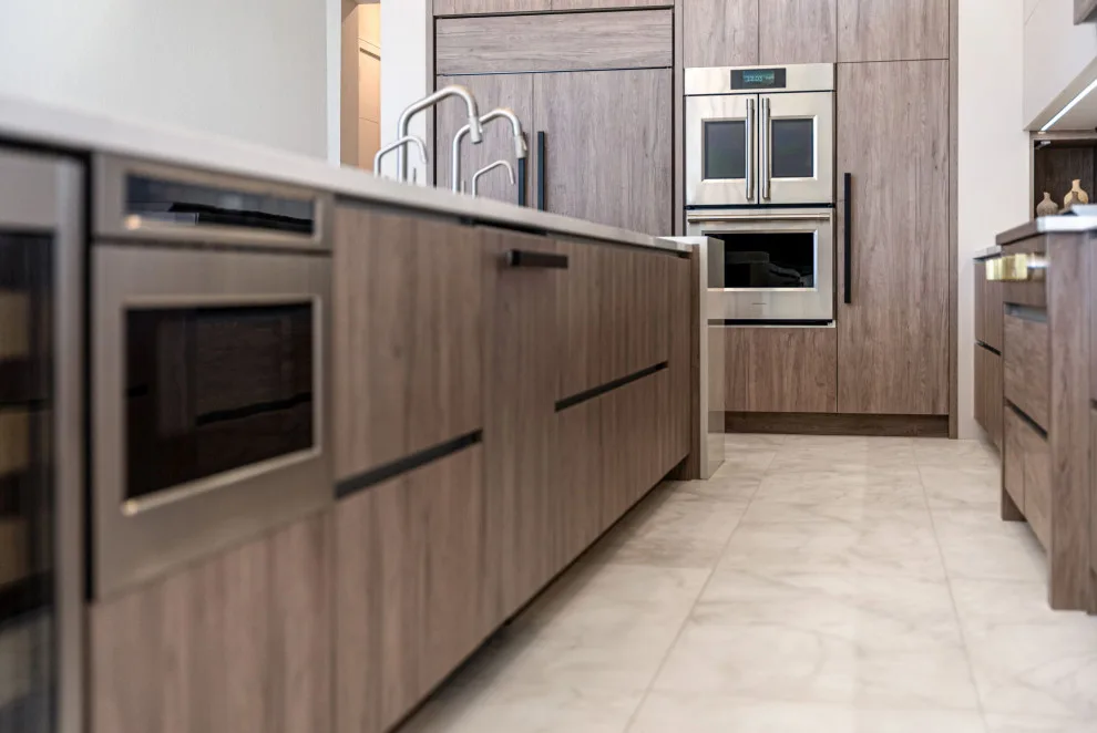 Spacious Modern Two-Tone Kitchen in West Bay by DaVinci Kitchens, Bath, & Cabinetry - Photo 9