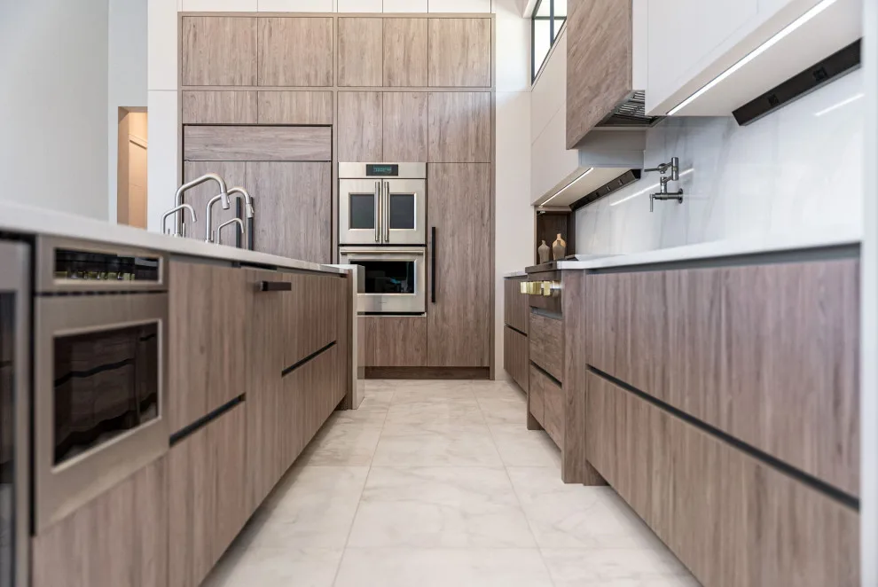 Spacious Modern Two-Tone Kitchen in West Bay by DaVinci Kitchens, Bath, & Cabinetry - Photo 12