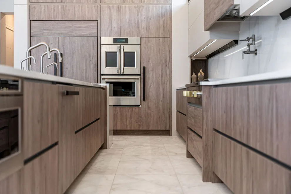 Spacious Modern Two-Tone Kitchen in West Bay by DaVinci Kitchens, Bath, & Cabinetry - Photo 5