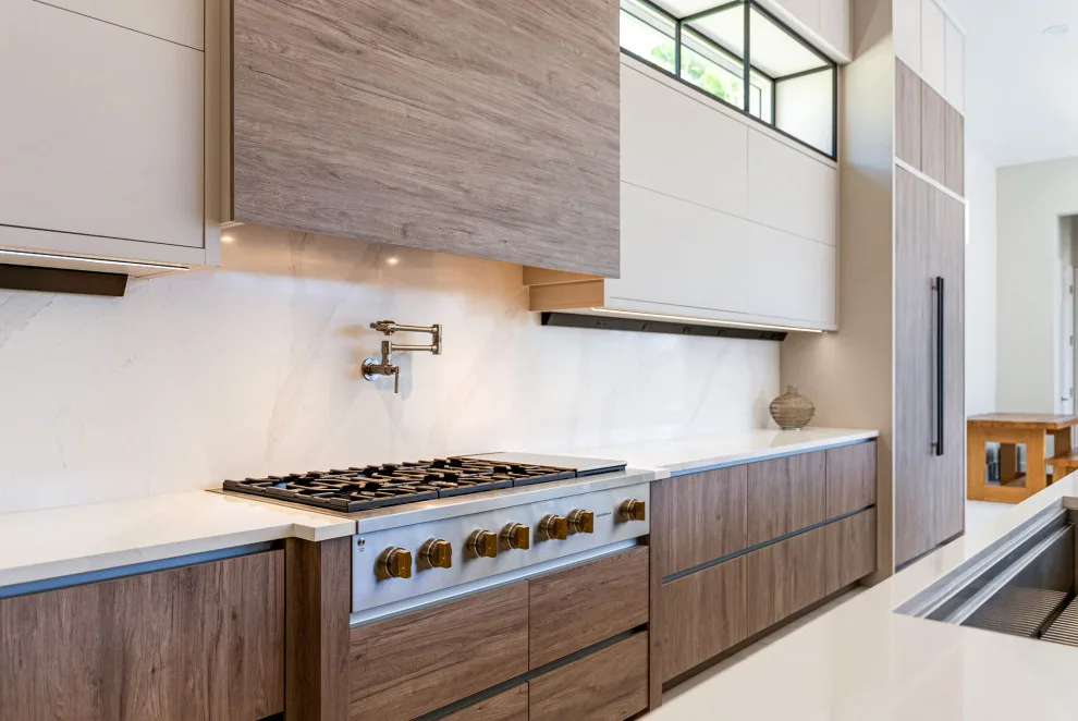 Spacious Modern Two-Tone Kitchen in West Bay by DaVinci Kitchens, Bath, & Cabinetry - Photo 31