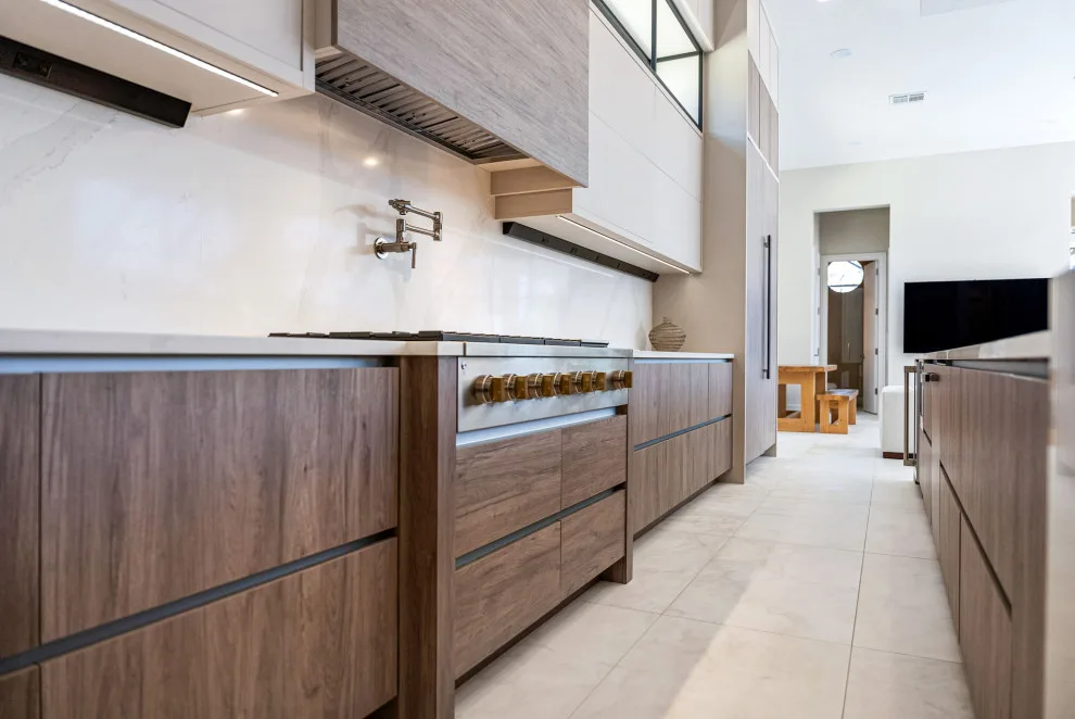 Spacious Modern Two-Tone Kitchen in West Bay by DaVinci Kitchens, Bath, & Cabinetry - Photo 34