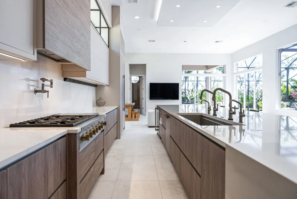 Spacious Modern Two-Tone Kitchen in West Bay by DaVinci Kitchens, Bath, & Cabinetry - Photo 13