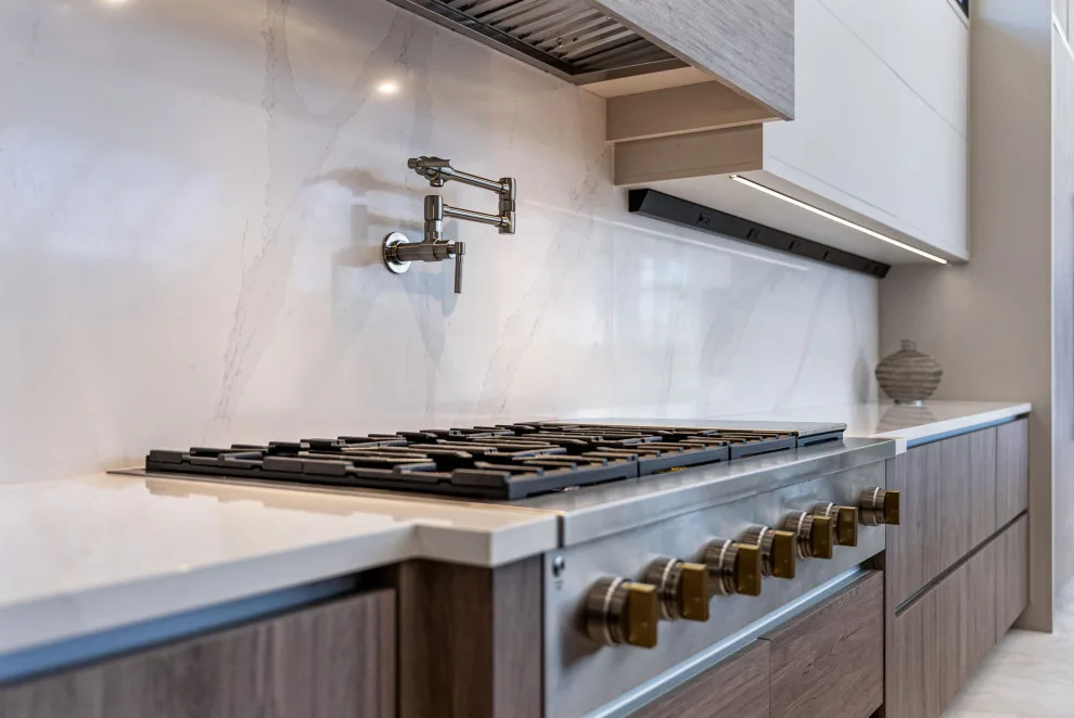 Spacious Modern Two-Tone Kitchen in West Bay by DaVinci Kitchens, Bath, & Cabinetry - Photo 30