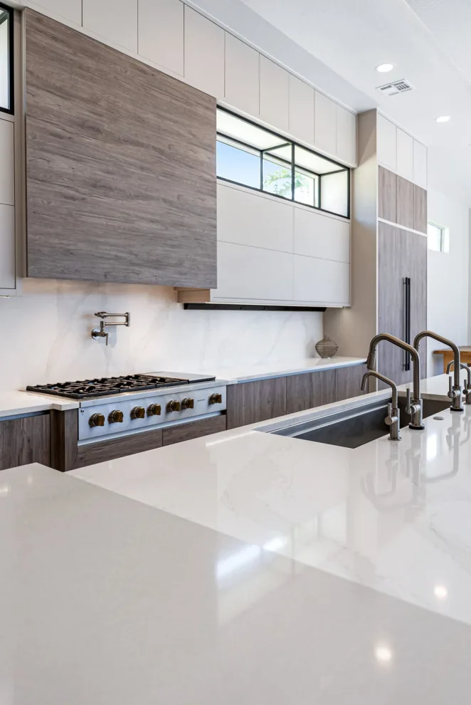 Spacious Modern Two-Tone Kitchen in West Bay by DaVinci Kitchens, Bath, & Cabinetry - Photo 20