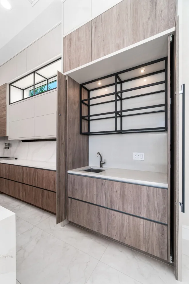 Spacious Modern Two-Tone Kitchen in West Bay by DaVinci Kitchens, Bath, & Cabinetry - Photo 8