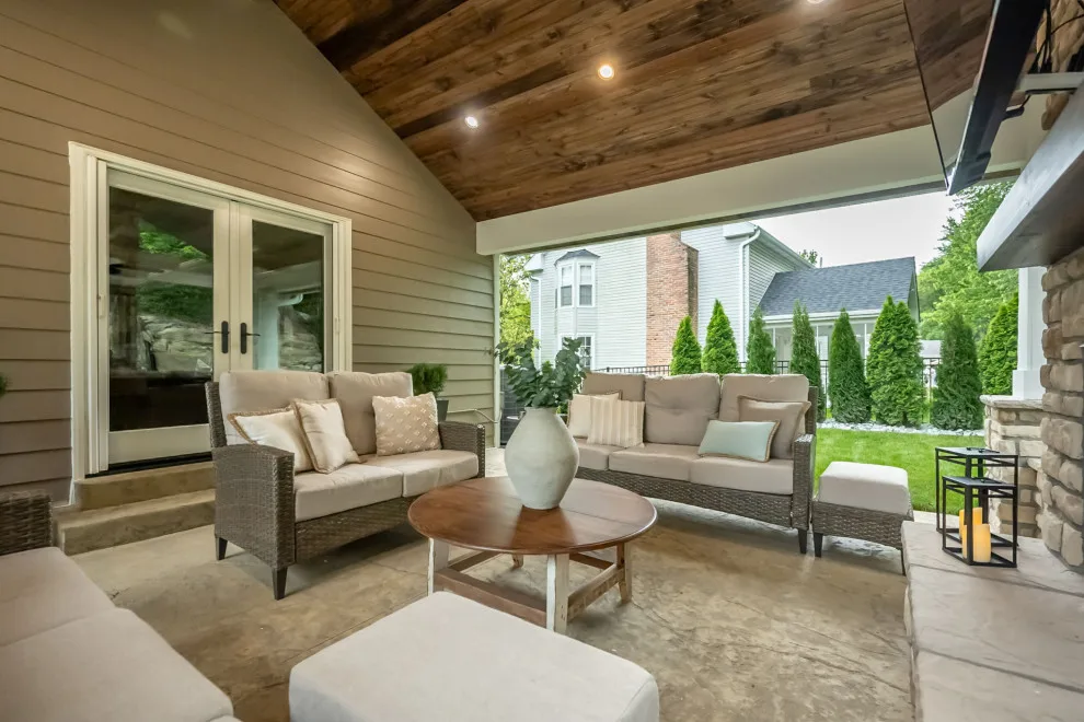 Back Patio Awning with Stone Hearth by Lakeside Renovation & Design - Photo 7