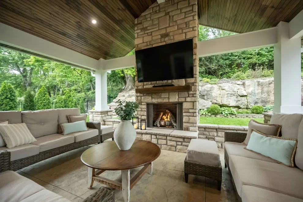 Back Patio Awning with Stone Hearth by Lakeside Renovation & Design - Photo 4