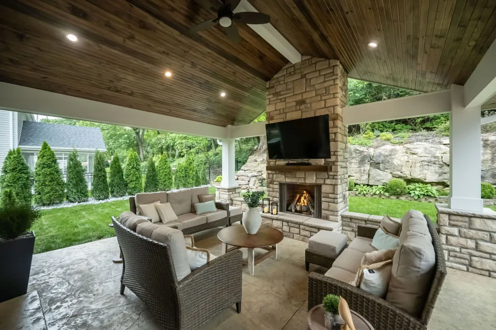 Back Patio Awning with Stone Hearth by Lakeside Renovation & Design - Photo 5