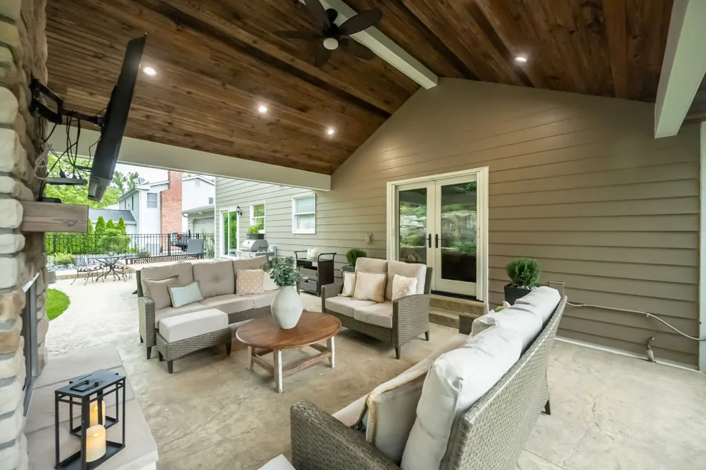 Back Patio Awning with Stone Hearth by Lakeside Renovation & Design - Photo 10