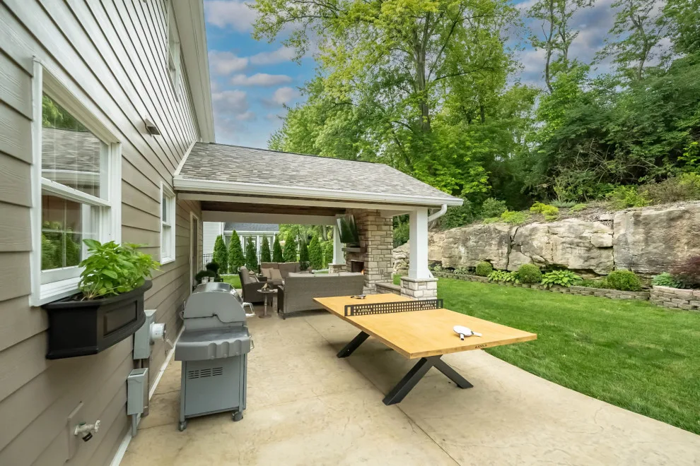 Back Patio Awning with Stone Hearth by Lakeside Renovation & Design - Photo 9