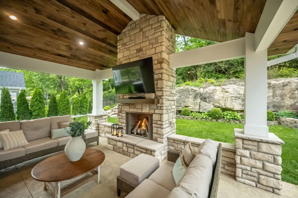 Back Patio Awning with Stone Hearth by Lakeside Renovation & Design - Photo 6