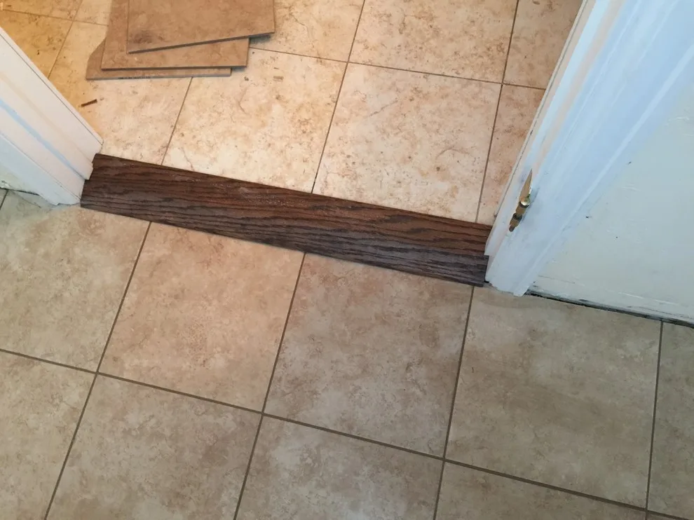 Floor Tile Replacement After Water Damage Repair by Big Horn Construction, LTD - Photo 2