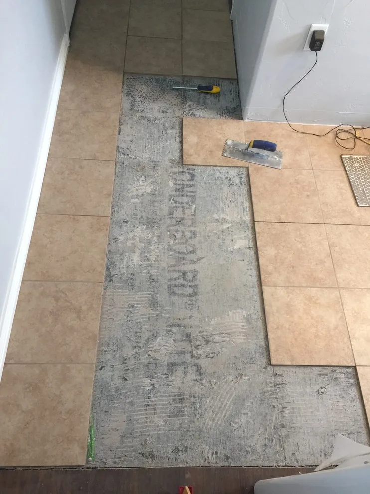 Floor Tile Replacement After Water Damage Repair by Big Horn Construction, LTD - Photo 4